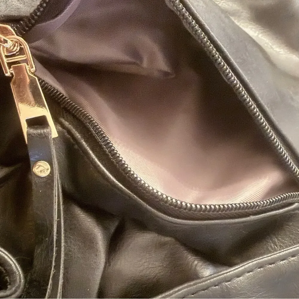 Black Leather Modern + Chic Bag backpack EUC. Lined w/purple. Looks New!